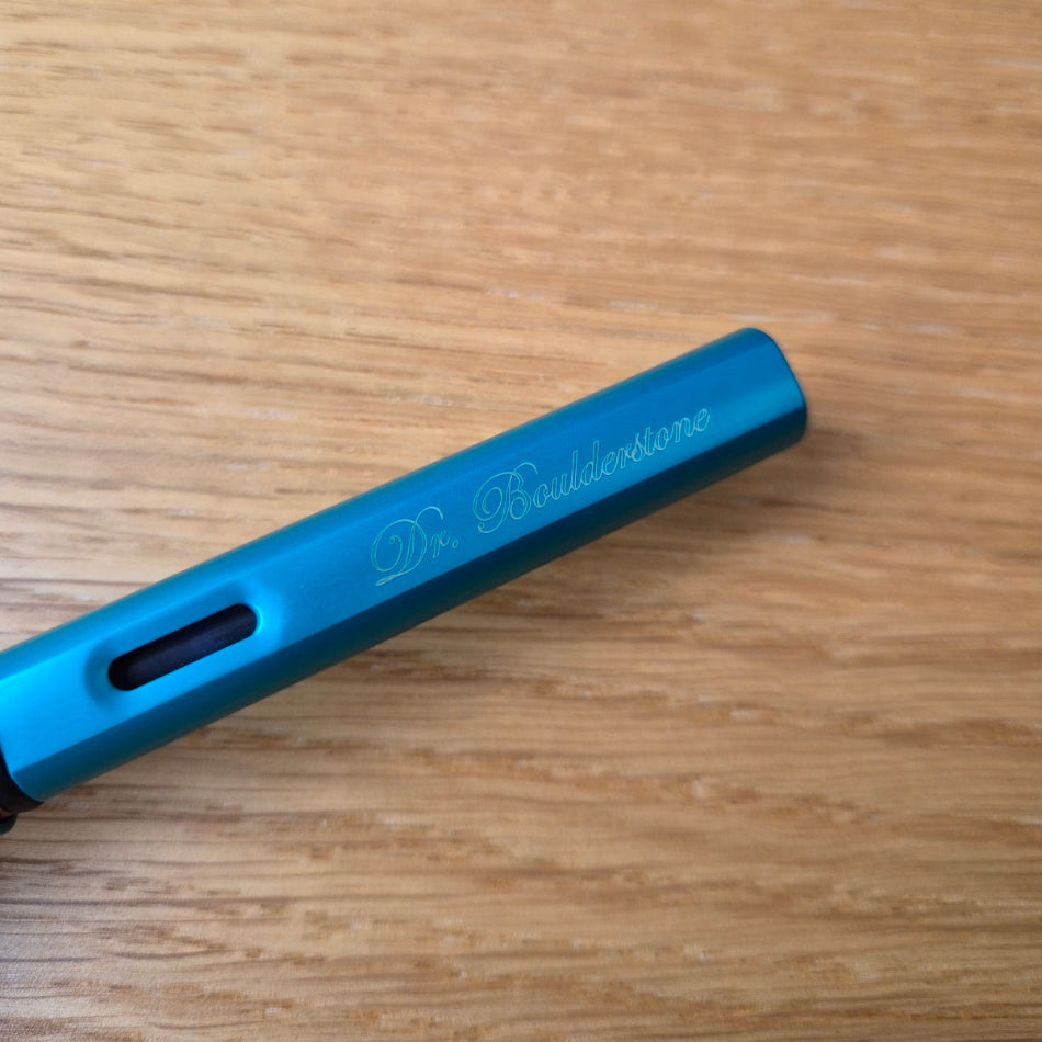 Cursive engraving on a Lamy Turquoise Blue AL Star Fountain Pen
